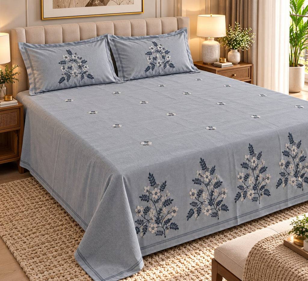 Delft Blue Fern Blossom embroidered king size bedsheet on bed