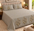 Tuscany Champagne Bouquet embroidered king size bedsheet on bed